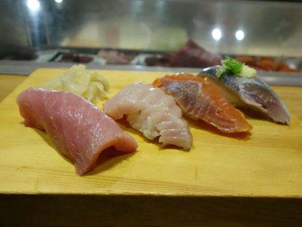 Some sushi: two types of tuna toro, smoked salmon, and sardine